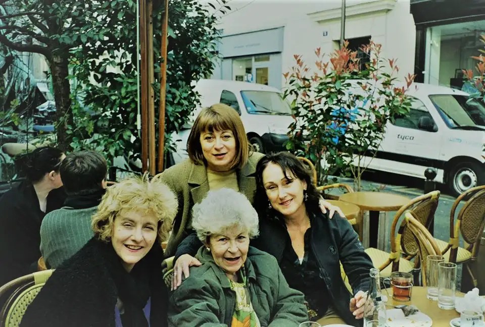 Friends sitting at Paris table for global book club